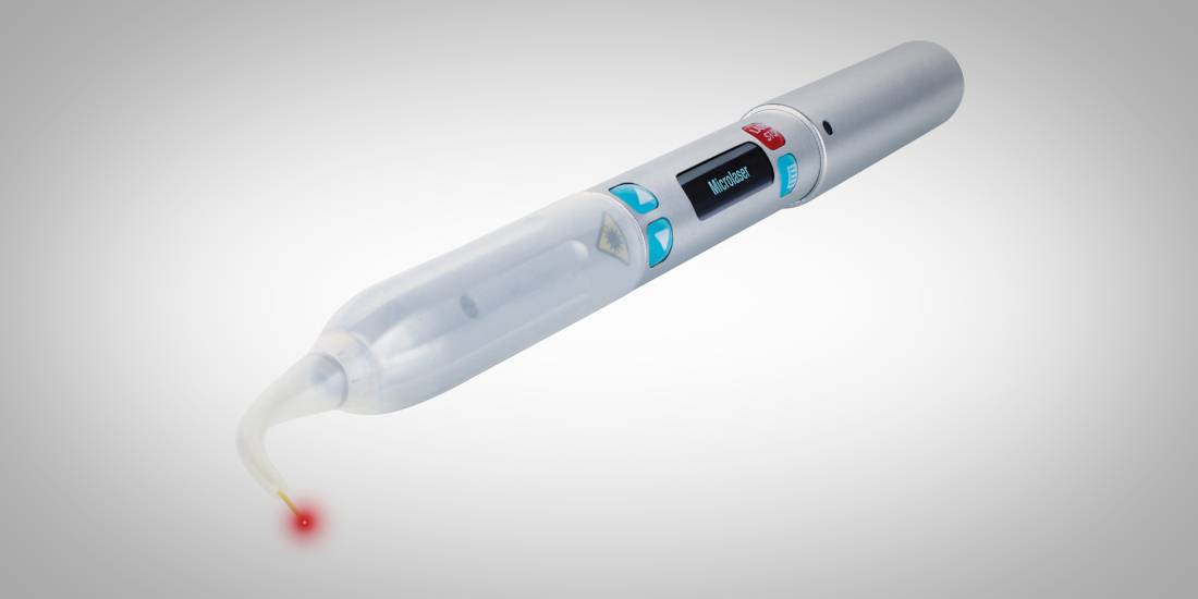 Medical laser handpiece with a red aiming beam at its tip
